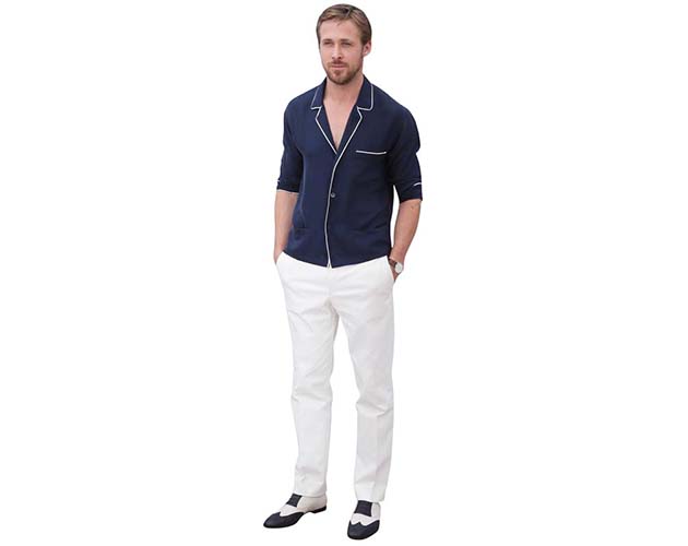 A Lifesize Cardboard Cutout of Ryan Gosling wearing white trousers